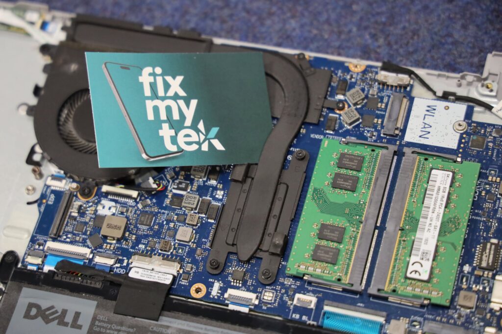 FixMyTek business card on top of a motherboard